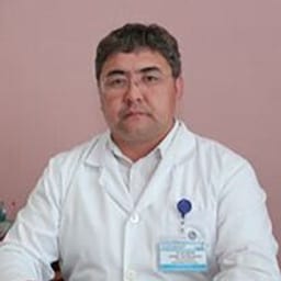 Портретный снимок врача, приём в городе Астана