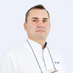 Портретный снимок врача, приём в городе Астана