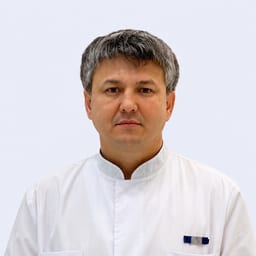 Портретный снимок врача, приём в городе Астана